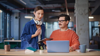 Fototapeta premium Two colleagues greeting webcam laptop starting online meeting in office closeup.