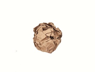 A crumpled brown paper ball isolated on white background.	