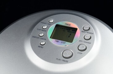 Close-up of vintage portable CD player with digital display