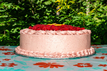 A birthday cake on a table outside