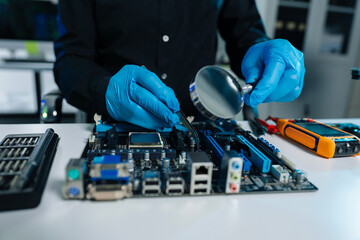 Hands repairing electronic devices. Electronic technician.
