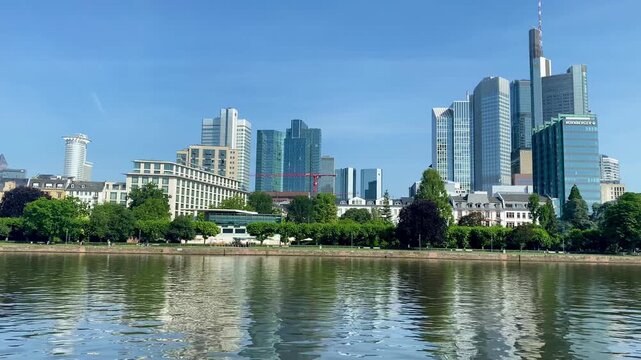 Clear blue skies over the modern skyscraper cityscape of Frankfurt, Germany.