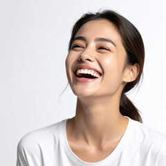 Studio portrait of a laughing woman on white background