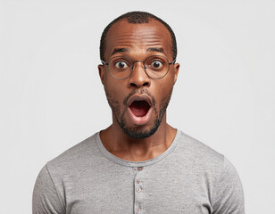 Studio portrait of a surprised man on white background