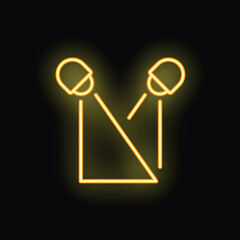 Yellow neon microphone icon glowing in the dark, concept of podcast, audio recording or singing