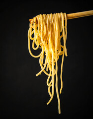 Delicious Noodles Being Held With Chopsticks Against Black Background