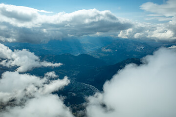 Alpine Valley View Through Clouds