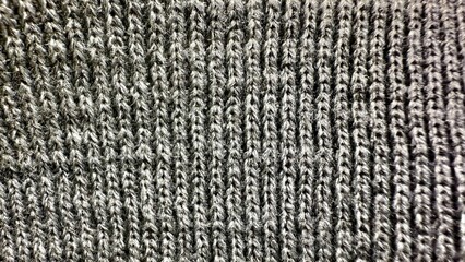textured gray knitted fabric close-up intricate weave soft cozy pattern for commercial use or interior design backgrounds