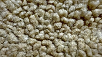 close-up of soft fluffy textured fabric with delicate fibers and plush clusters perfect for cozy interior design or tactile visuals
