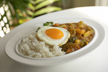 Shrimp curry and fried egg