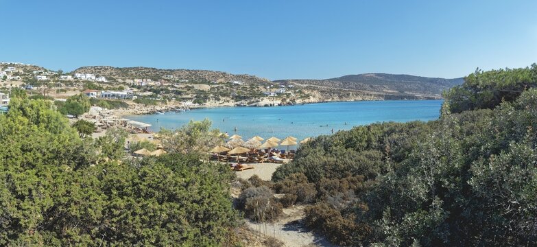 Mega Amoopi beach with parasols and surrounding vegetation, Ammopi, Lakki, Karpathos, Greece