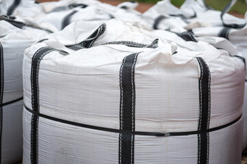 A big bag package, using to contain chemical or sand material that prepare for the transportation. Industrial equipment object.