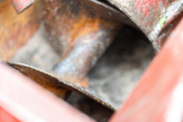 Close-up at turning screw part of the chemical blender machine. The equipment that using to feed and blending the chemical. Industrial equipment object, selective focus.
