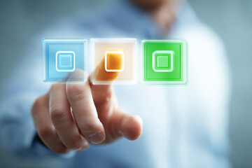 Businessman Interacting with Virtual Screen Featuring Color Icons