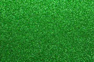 Vibrant emerald green glitter sparkle texture background with subtle shimmer