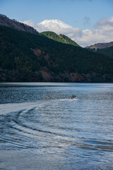 Boat Sailing on Lake with Mount Fuji in Japan