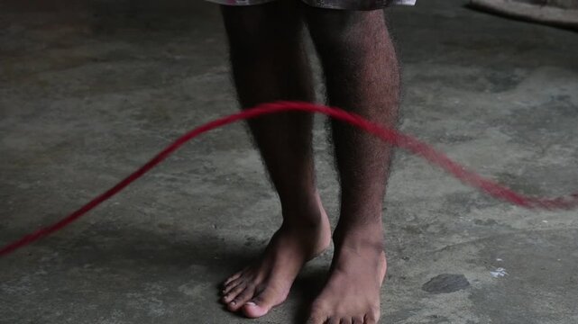 A man is Skipping. Jumping rope, also known as skipping, is a highly effective and accessible full-body workout with a wide range of benefits for your physical and mental health. 
