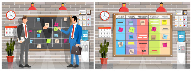 Two men managers standing near office schedule board. Office meeting and task management. Team work and business planning.