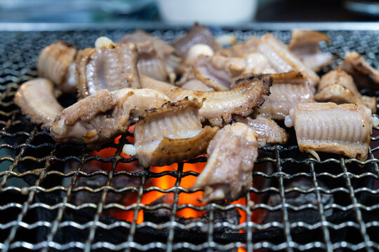roasting hagfish (sea eel) on the charcoal grill
