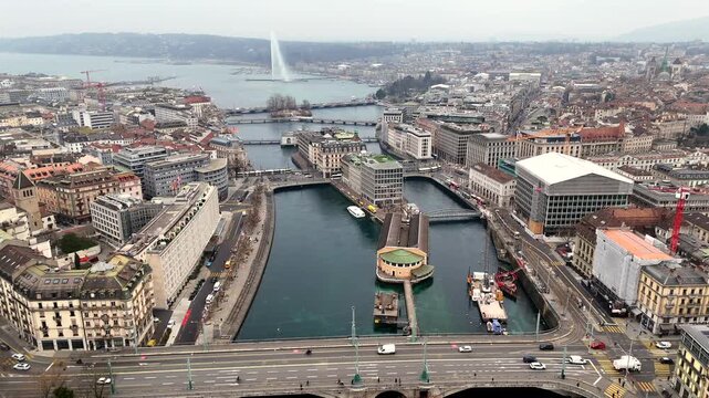 Panoramic aerial view of Geneva with Rhone river Batiment des Forces Motrices bridges and Jet dEau fountain