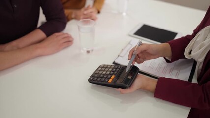 Real estate agent advises adult couple property investment plans discuss digital tablet meeting professional expert client financial home purchase - Powered by Adobe