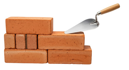 Isolated Stack of bricks with a trowel for construction building home improvement work