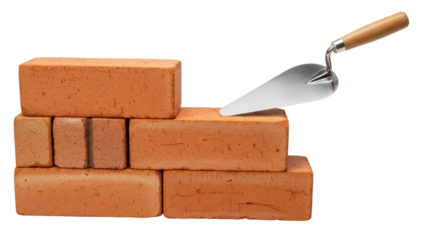 Isolated Stack of bricks with a trowel for construction building home improvement work