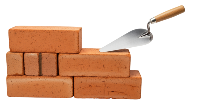 Isolated Stack of bricks with a trowel for construction building home improvement work