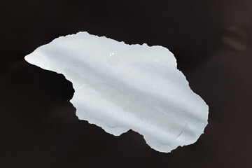 Wet paper. A wet stain on white paper. Water on paper