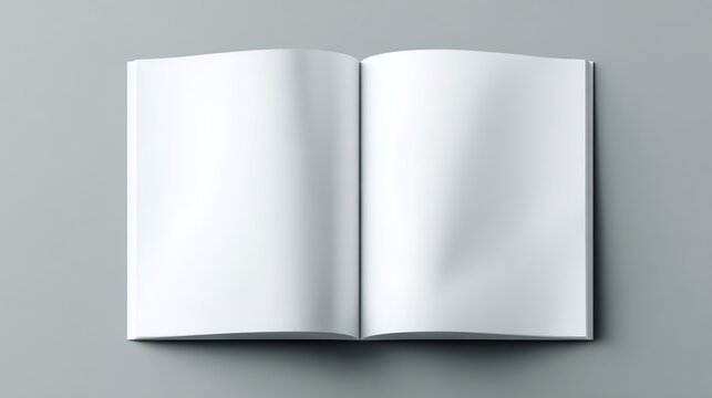 Overhead shot of an open book on a gray surface, blank pages, clean design, high contrast