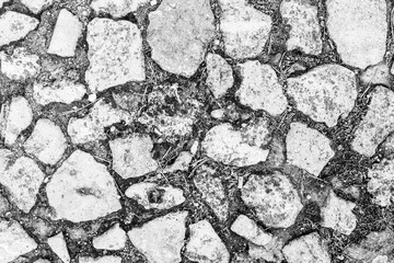 Old pedestrian street from large stones, top view. Pavement background for publication, design, poster, calendar, post, screensaver, wallpaper, postcard, banner, cover, website. High quality photo