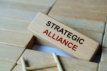 Strategic alliance text written on wooden blocks symbolizing powerful partnerships and strategic...