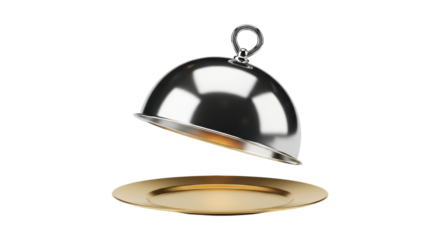 Shiny silver cloche domed lid hovering over elegant gold plate