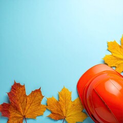 Autumnal Construction Safety Image with Orange Hard Hat and Maple Leaves.