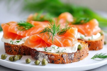 Fresh smoked salmon on crispy bread with cream cheese and dill garnish