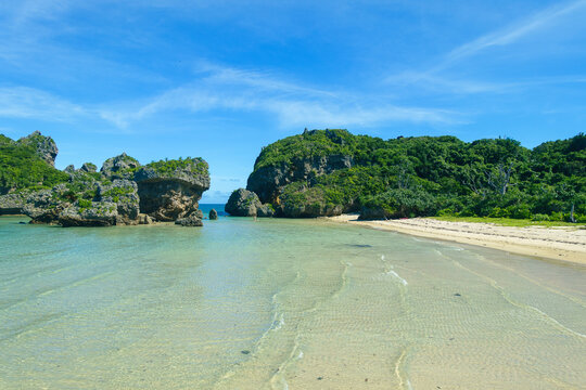 A clean small beach surrounded by natural reefs
