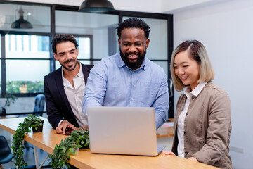 team of multiethnic colleague discuss business topic in creative green office co working space, group of business people coworker casual online meeting on tablet standing desk modern office workplace