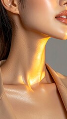 Close-up of a woman's neck and chest, sunlit