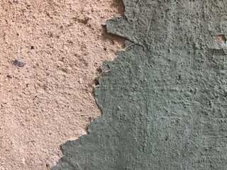 textured gray concrete stone wall with cracks, peeling paint urban background wallpaper texture