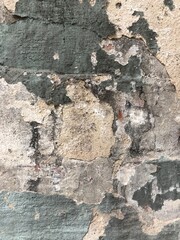 textured gray concrete stone wall with cracks, peeling paint urban background wallpaper texture