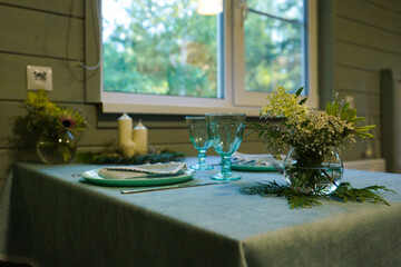 The table is beautifully decorated for the celebration, with a neatly folded napkin placed on each plate, adding elegance to the festive atmosphere.