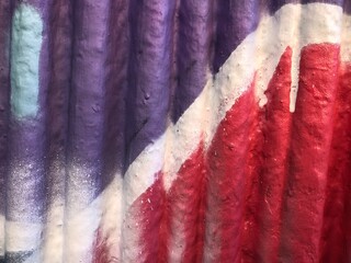 Textured 3d wall red and purple street-art graffiti paint wallpaper background web texture