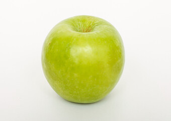 A vibrant green apple isolated on a clean white background.