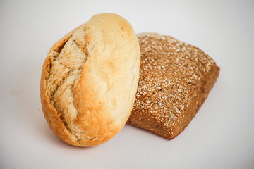 Freshly baked bread rolls on a white background