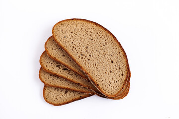 Slices of fresh rye bread arranged on a white surface.