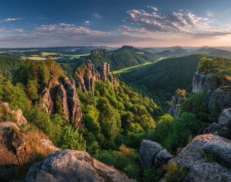 Panoramic view of a mountainous landscape at sunset. Lush green forests surround rocky peaks - Powered by Adobe