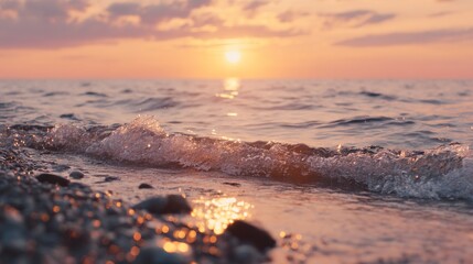 The beautiful sunrise over the sea, with pebbles in the foreground in front of the camera, captures a cinematic scene, and the sky along with the shallow depth of field creates a surreal effect.