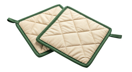 Isolated pair of beige quilted potholders with green trim for kitchen cooking utensils