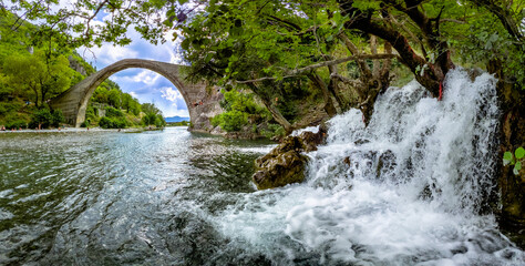 Traditional Stone Bridge in Konitsa The Grand Single Arch Bridge at the Entrance of Aoos Gorge Historic Landmark and Scenic Nature in Greece Featuring Picturesque Views and Cultural Significance