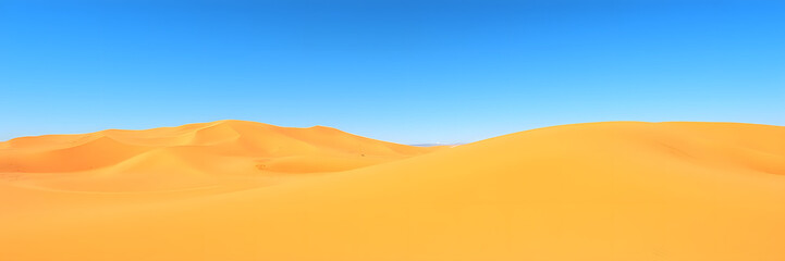 Fototapeta premium Vast golden desert dunes under clear blue sky, natural beauty